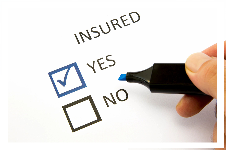 A person is filling out an insured questionnaire.