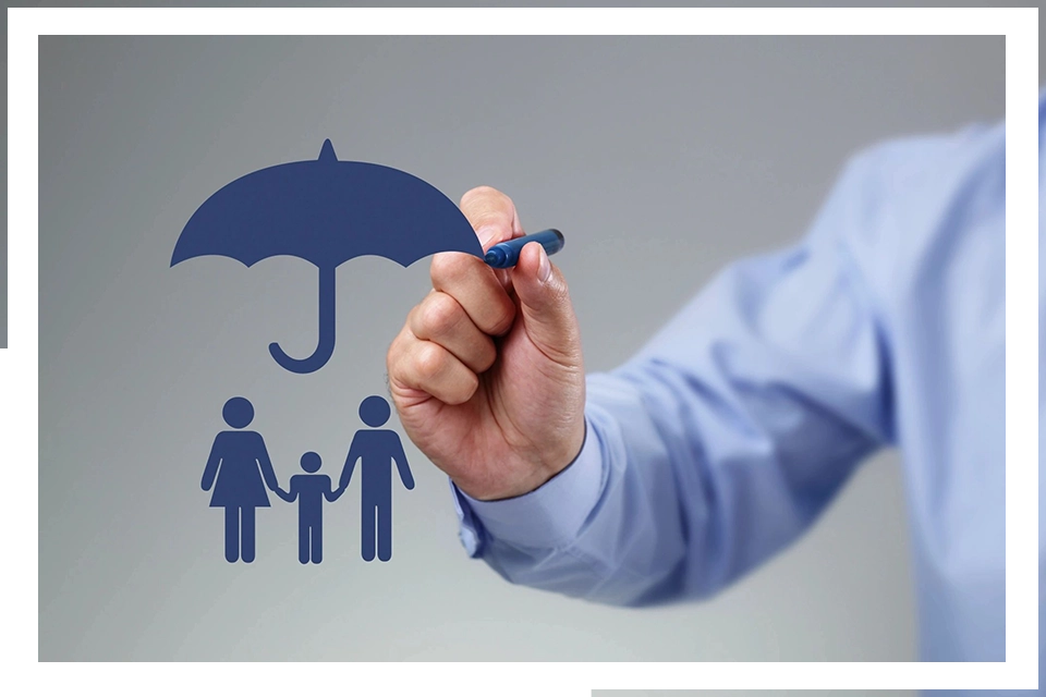 A person holding an umbrella over their family.